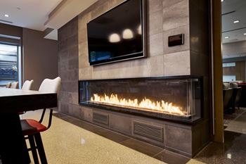 Transparent, linear glass indoor fireplace